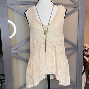 Cream Sleeveless High Low Knit Top